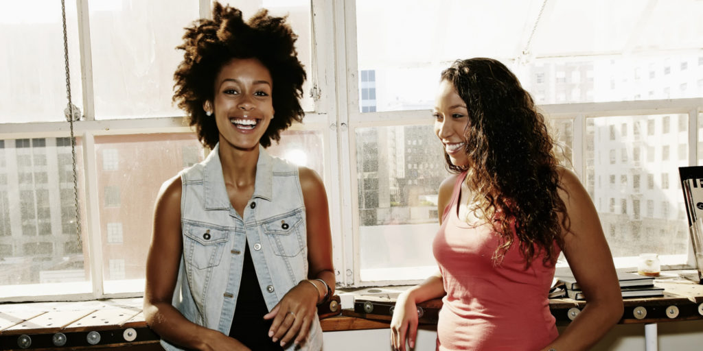 Women smiling together